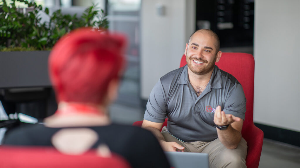 Career Services staff member talking with a student