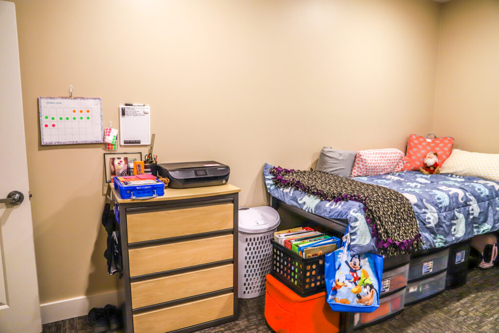 Bedroom with two beds and dressers