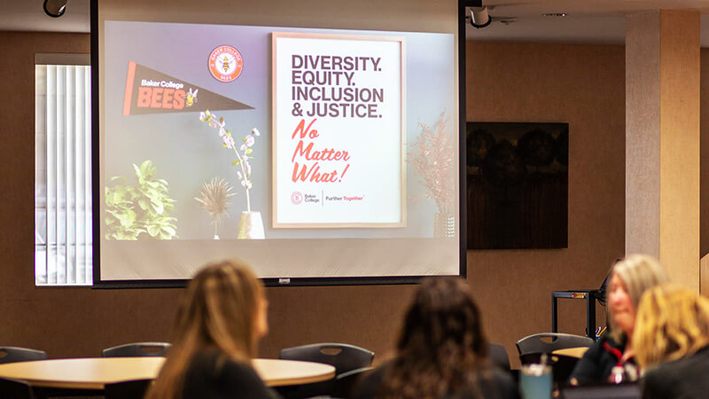 Presentation screen with a slide dispaying text that reads Diversity, Equity, Inclusion & Justice No Matter What!
